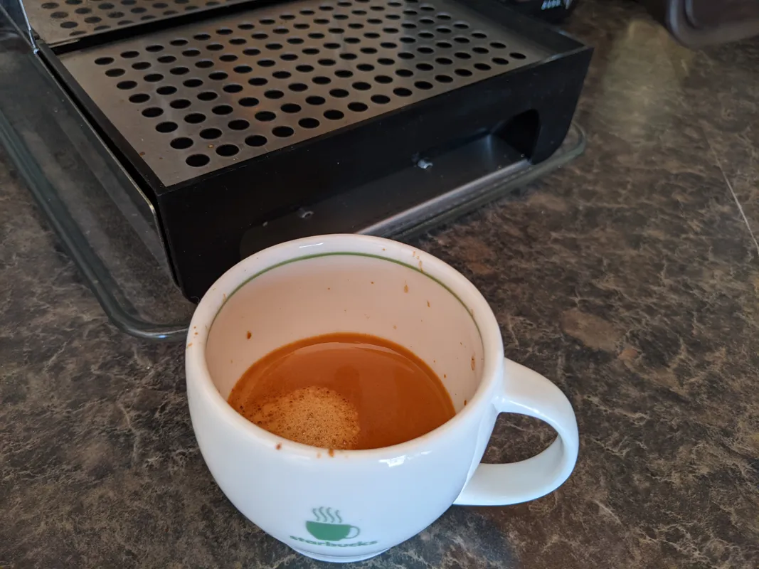 Espresso shot in a white cup
