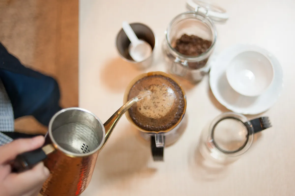 Pour-over coffee being made with a gooseneck kettle