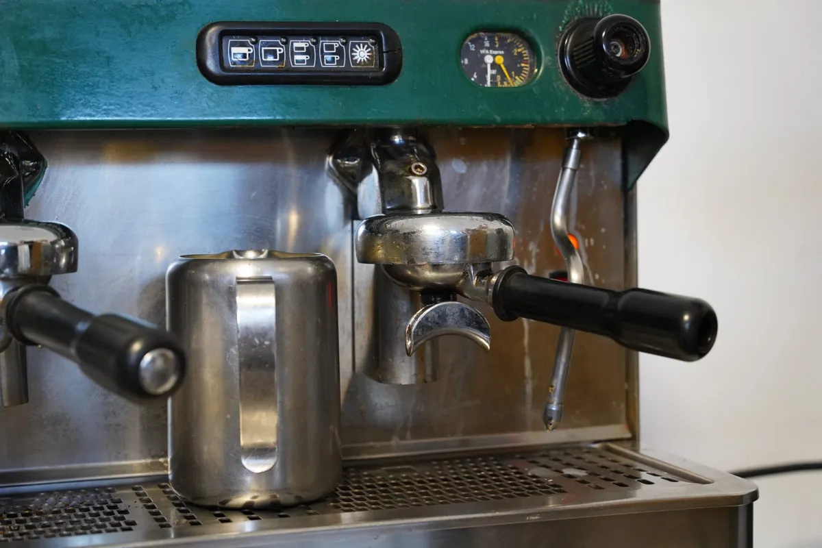 Close-up of a commercial espresso machine with portafilters